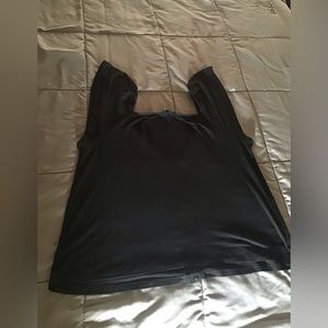 The simple black top you must have! Short sleeve, size Medium